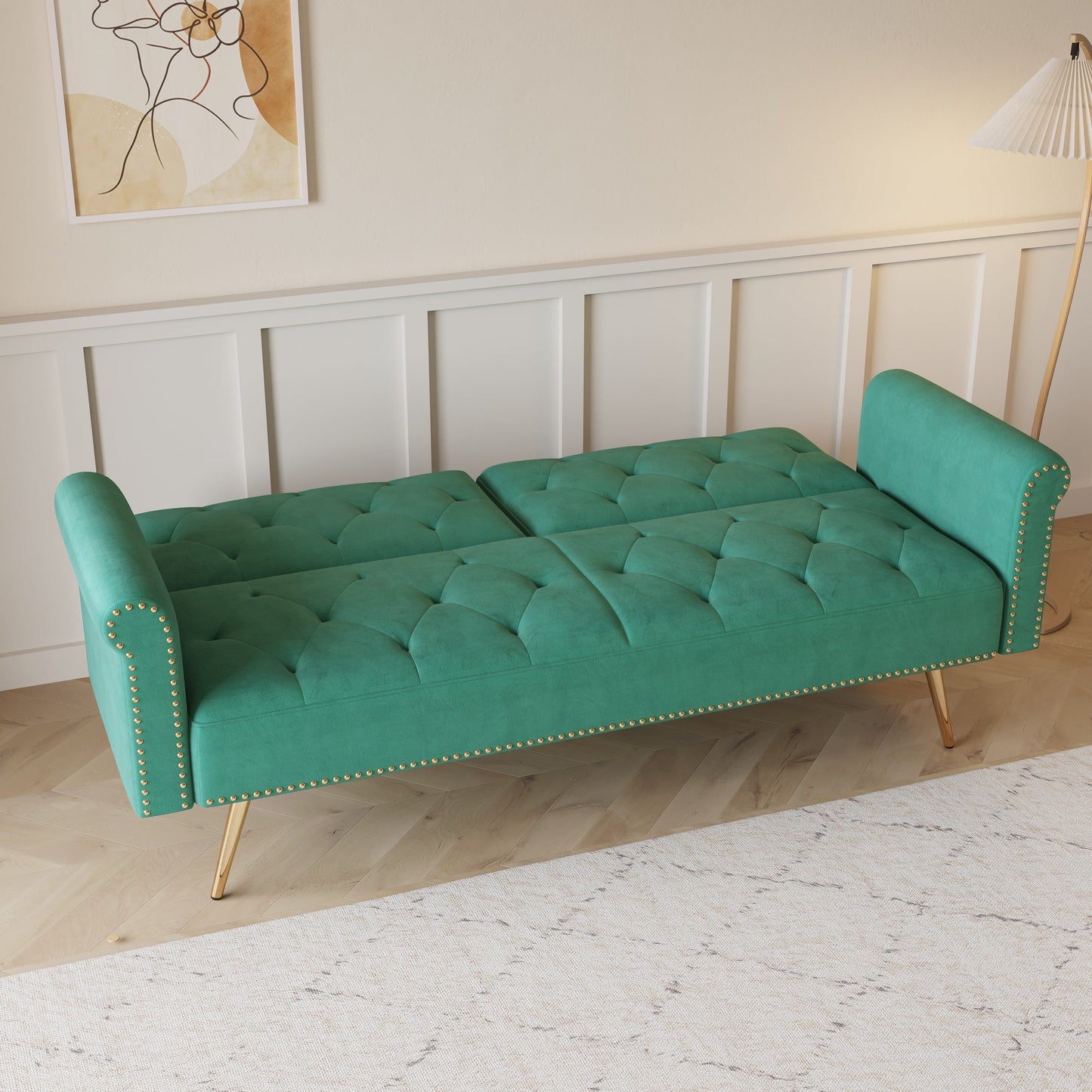 Divano letto con borchie in velluto e cuscino decorativo