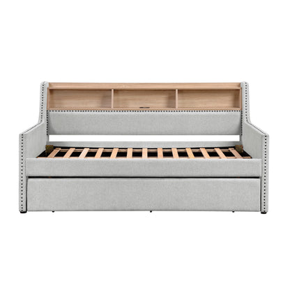 Divano letto grigio chiaro con libreria estraibile, pannello laterale, porte di ricarica, finiture con borchie, mobili dal design moderno