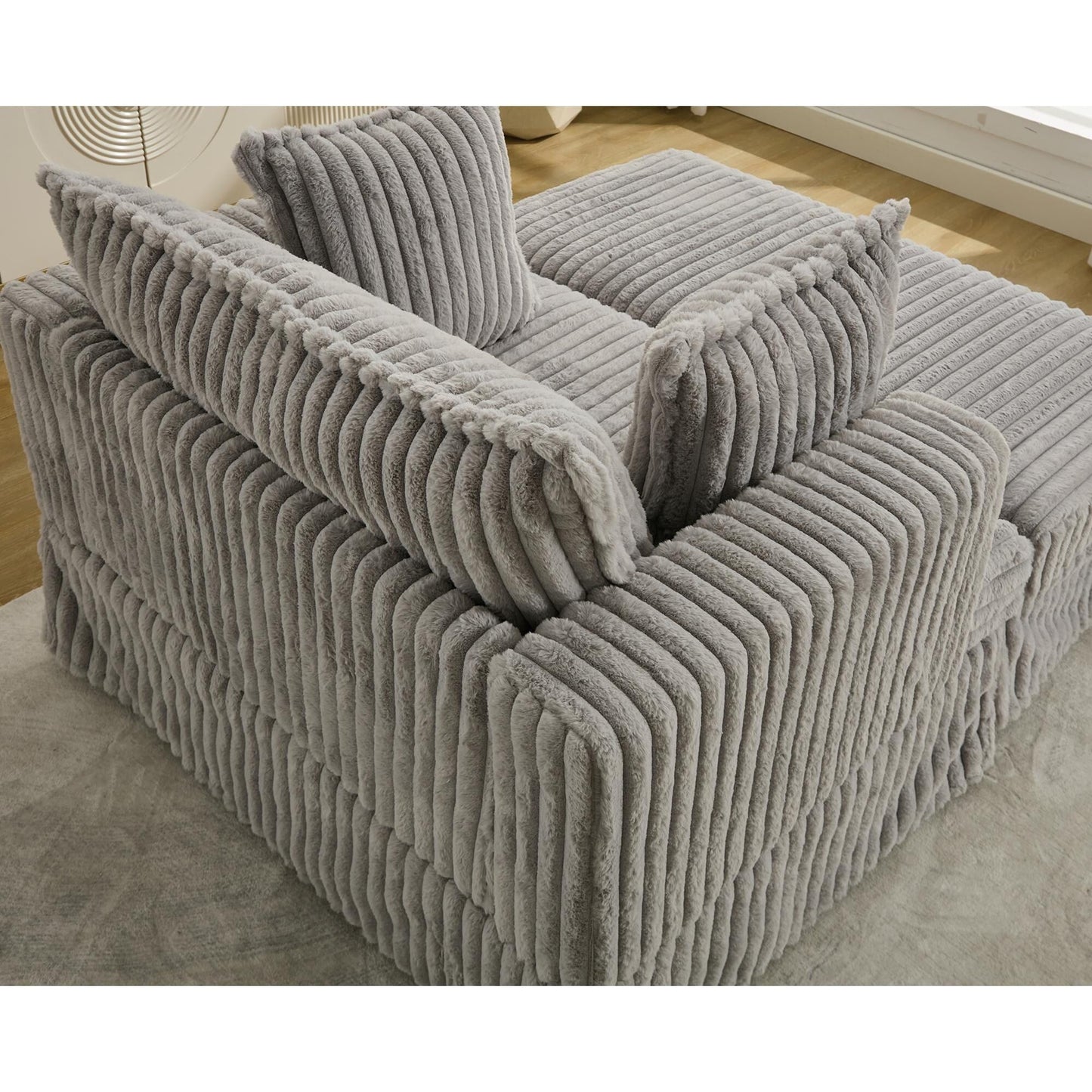 47.7 Chaise Longue oversize in velluto a coste con pouf