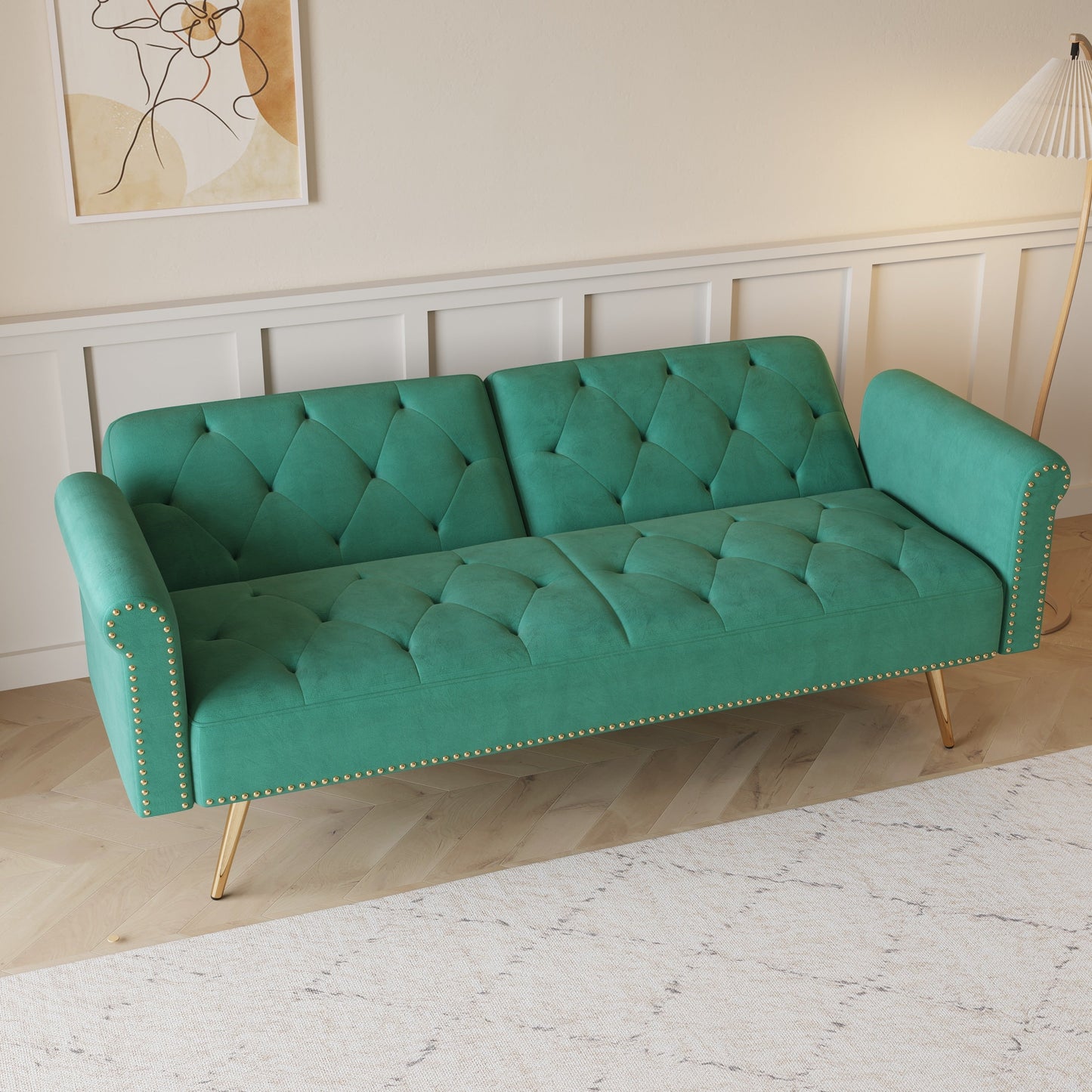 Divano letto con borchie in velluto e cuscino decorativo