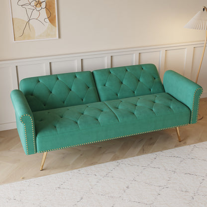 Divano letto con borchie in velluto e cuscino decorativo