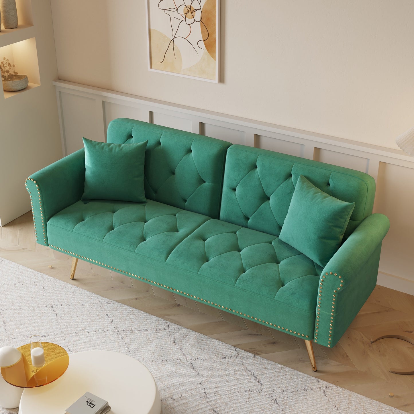 Divano letto con borchie in velluto e cuscino decorativo