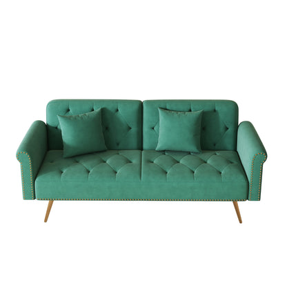 Divano letto con borchie in velluto e cuscino decorativo