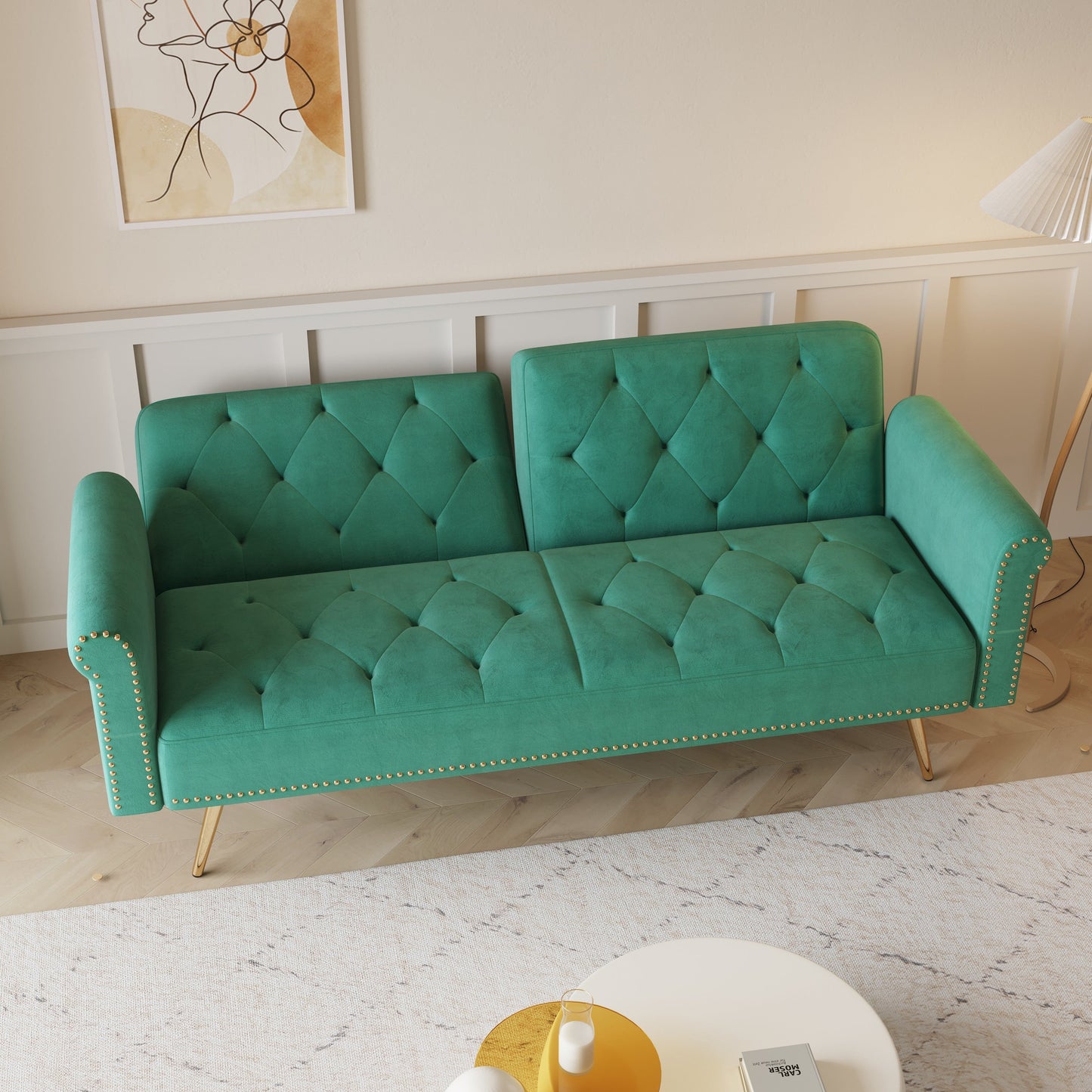Divano letto con borchie in velluto e cuscino decorativo