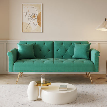 Divano letto con borchie in velluto e cuscino decorativo