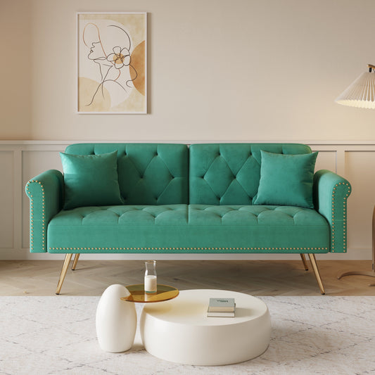 Divano letto con borchie in velluto e cuscino decorativo