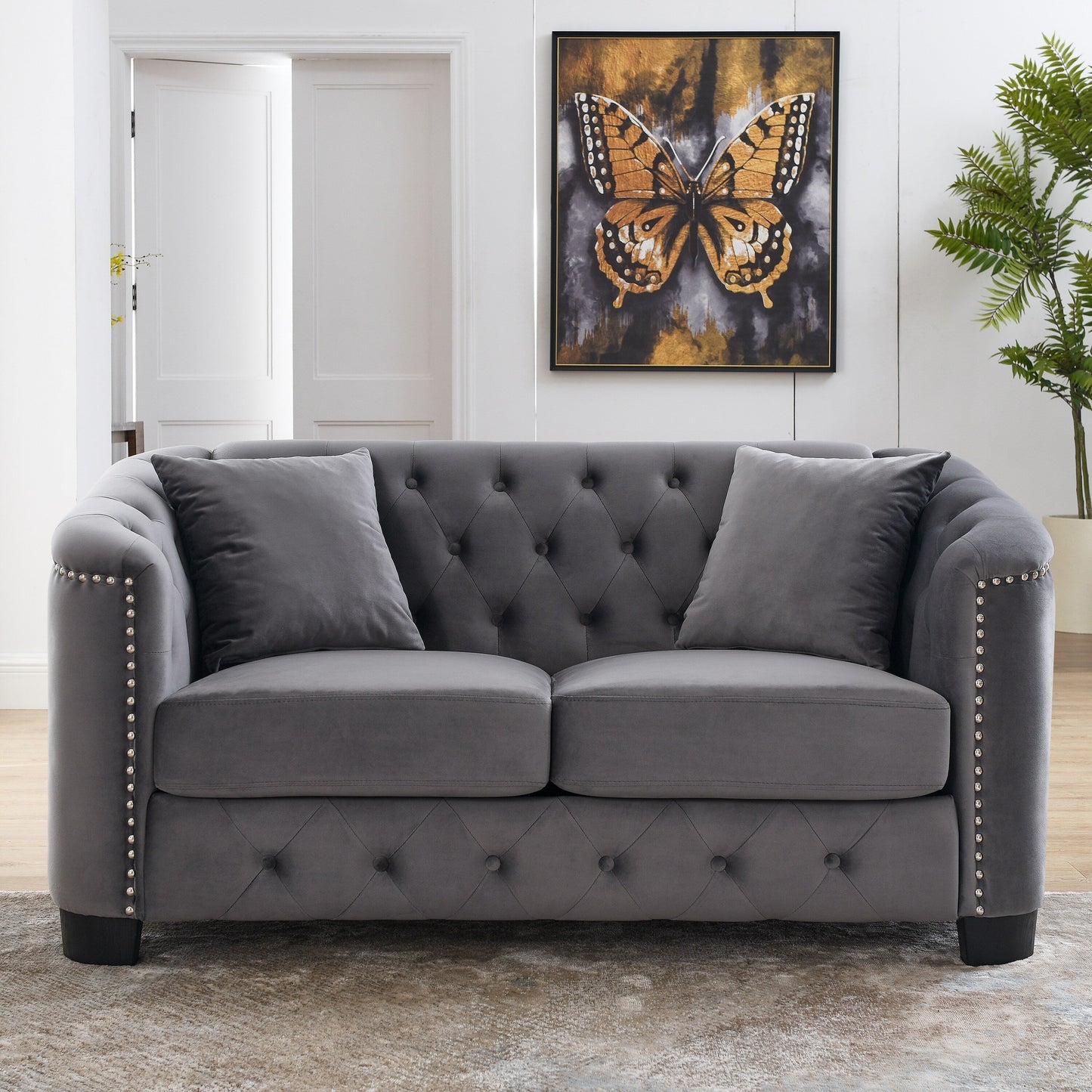 Divano moderno in velluto a 3 posti da 77'' con schienali trapuntati, finiture con borchie e 2 cuscini
