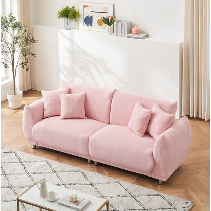 Divano rosa in pile di peluche da 86,6 pollici con quattro cuscini e piedini in metallo che può stare comodamente in una camera da letto di un appartamento
