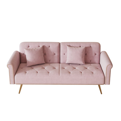 Un divano letto lungo 69,7 pollici rivestito in tessuto di velluto, con finiture a borchie e accompagnato da un cuscino coordinato.