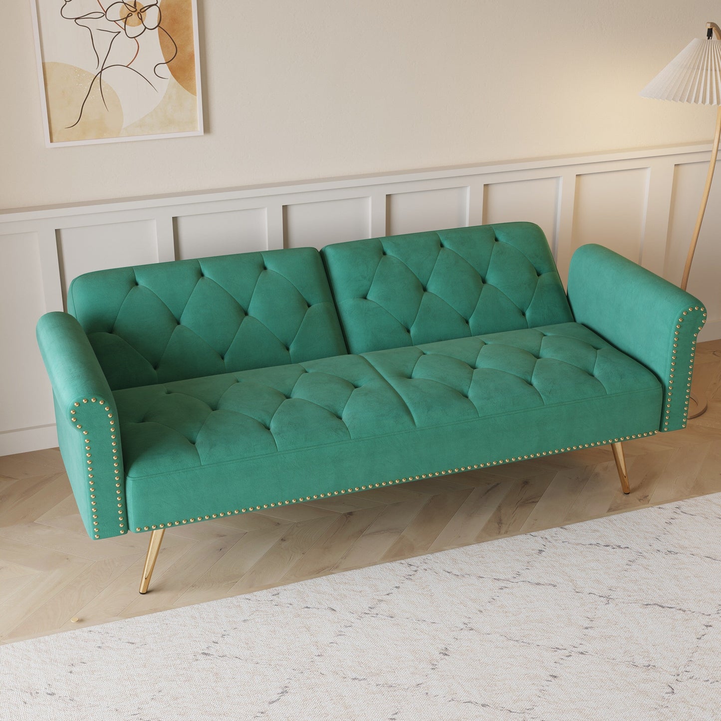 Un divano letto lungo 69,7 pollici rivestito in tessuto di velluto, con finiture a borchie e accompagnato da un cuscino coordinato.