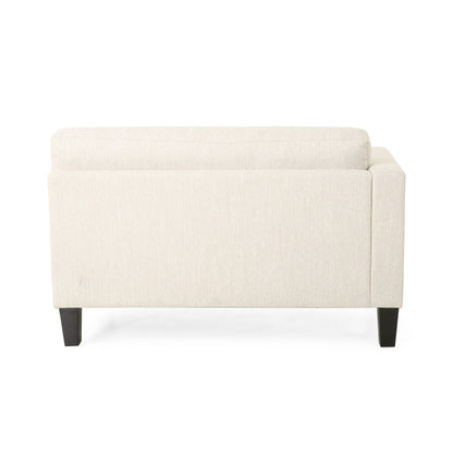 Divano beige a 3 posti con gambe in legno e due cuscini