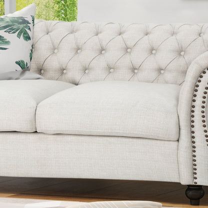 Divano a due posti Chesterfield beige con bottoni e borchie