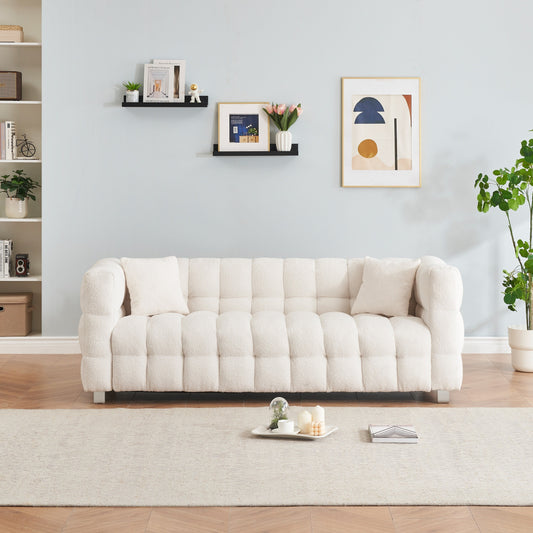 Divano Teddy beige a 3 posti con due cuscini decorativi