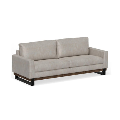 Divano Bery, base moderna in legno massello di pino, morbida similpelle color avorio bianco