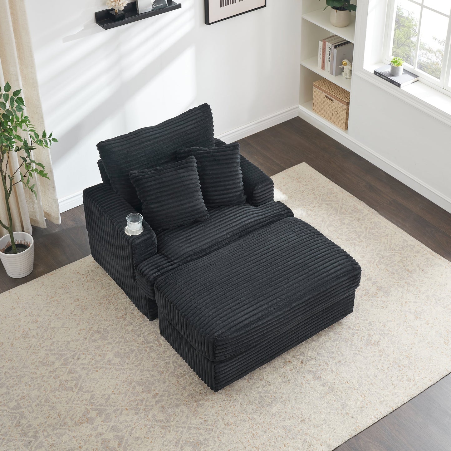 Poltrona in velluto a coste nero con pouf e portabicchieri