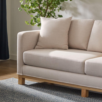 Divano imbottito con base in legno Brookside Kay