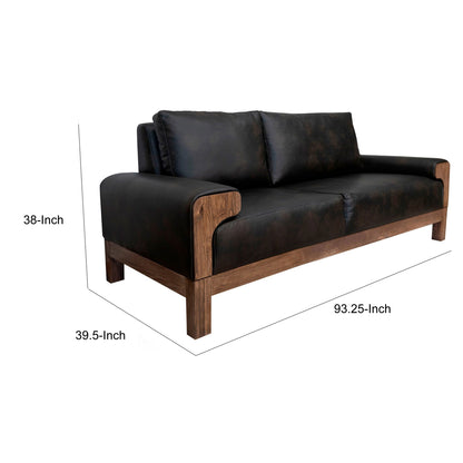 Divano Caisy, similpelle nera, struttura in legno massello color caramello, 93 pollici