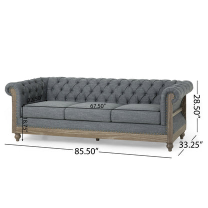 Divano Chesterfield a 3 posti con bottoni capitonné color carbone e gambe in legno