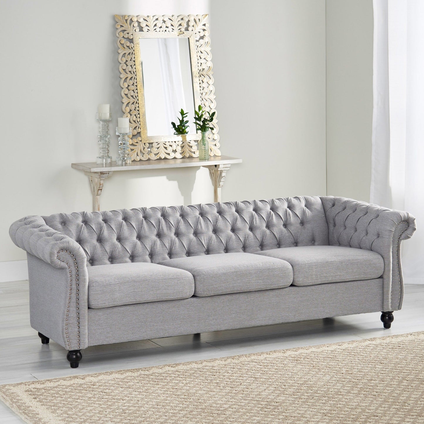 Divano Chesterfield a 3 posti con bottoni e borchie