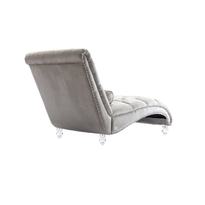 Poltrona reclinabile ergonomica a forma di S con cuscino, finiture con borchie e gambe in acrilico per uso interno.